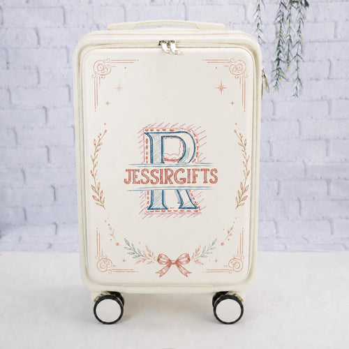 White custom logo carry-on suitcase with a JessiRGifts monogram example framed by delicate botanical motifs and a bow
