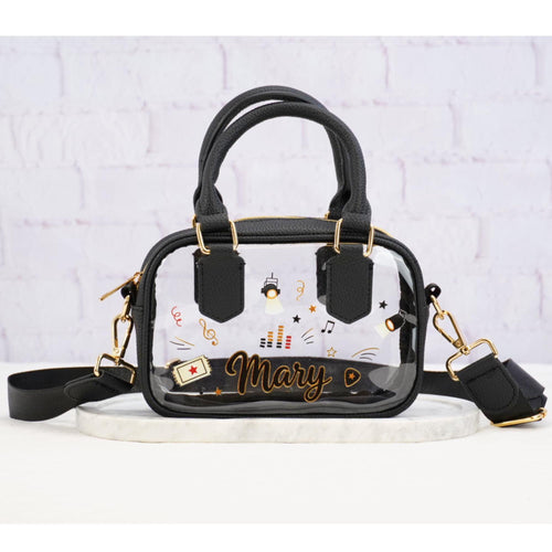 Clear stadium crossbody bag with black trim, shoulder strap and music graphics, personalized with example name Mary