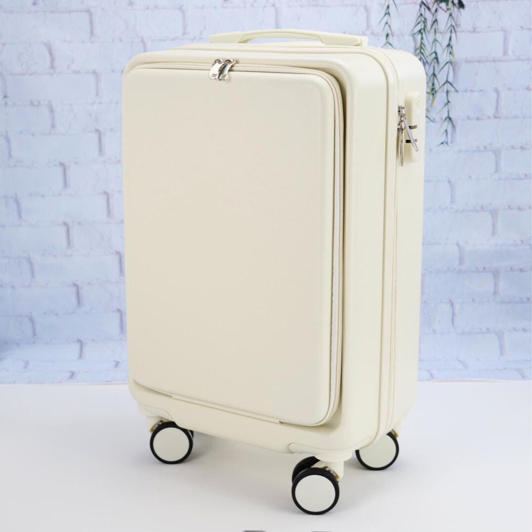 Angled front view of a plain white carry-on suitcase showing the zippered front panel, top handle and spinner wheels