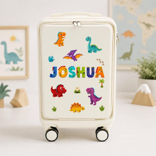 White dinosaur carry-on suitcase with colorful dinosaur illustrations and example name Joshua across the front