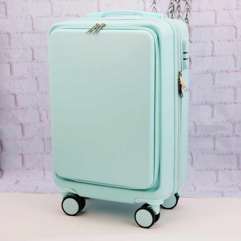 Angled front view of a plain mint green carry-on suitcase showing the zippered front panel and spinner wheels