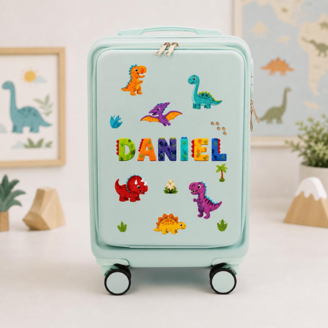 Mint green dinosaur carry-on suitcase with colorful dinosaur illustrations and example name Daniel across the front