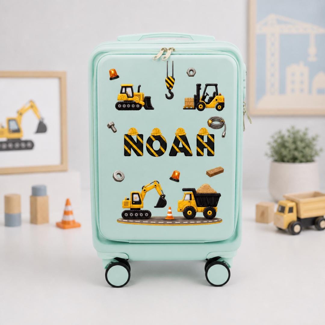 Mint green construction-themed carry-on suitcase with yellow diggers, dump truck graphics and an example personalized name