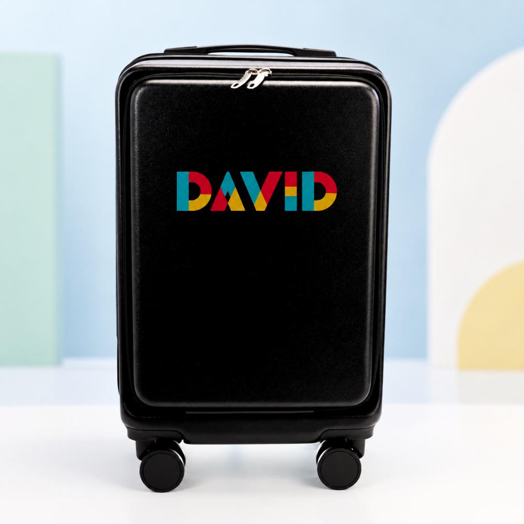 Black personalized carry-on suitcase with example name David in red, yellow and blue geometric lettering
